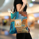 Marble watercolor monogram gold turquoise & orange tote bag<br><div class="desc">A sparkly, faux gold foil square with a script typography monogram initial overlays a rich, gold veined, turquoise blue, and yellow orange watercolor background on this elegant, trendy, girly, modern, monogramed tote bag. Makes a fun and stylish statement every time you use it. A great gift for a friend, as...</div>