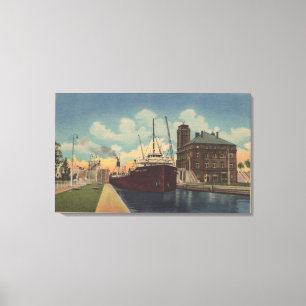Marie, MI - View of Freighter Leaving MacArthur Canvas Print
