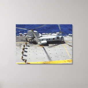 Marines board a CH-46E Sea Knight helicopter Canvas Print