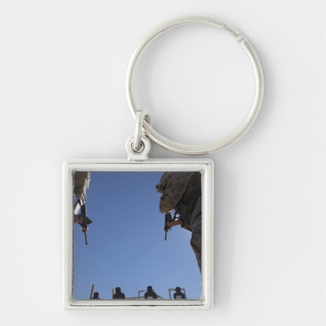 Marines change magazines in the midst of firing key ring (Front)