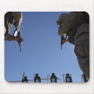 Marines change magazines in the midst of firing mouse mat