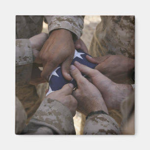 Marines fold an American flag Magnet