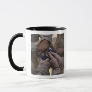 Marines fold an American flag Mug
