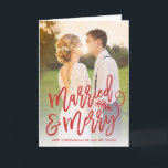 Married and Merry Holiday Photo Red<br><div class="desc">Make a stunning statement this holiday season with this stylish full-bleed 1 photo holiday card featuring "married and merry" in a chic red script. Perfect for the newly married couple to use as a wedding announcement or thank you card around the holidays. Available in additional colours and formats. Shop our...</div>