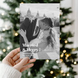 Married & Merry Black & White Christmas Photo  Holiday Card<br><div class="desc">Celebrate your first Christmas as a married couple with this “Married & Merry” black and white Christmas photo card. Perfect for newlyweds, this elegant and modern design highlights your favourite wedding photo with chic typography for a timeless look. A beautiful way to share your love story and holiday wishes with...</div>