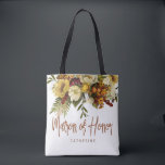 Matron of honour autumn fall wedding rustic bridal tote bag<br><div class="desc">Modern rustic matron of honour tote bag featuring autumn fall rusty orange gold and ivory cream flowers with dried leaves and foliage and a whimsical chic typography script.             Personalise it with matron's name on the front side and with the wedding couple names and date on the reverse.</div>