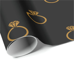 Matte Gold Engagement Rings on Black Wrapping Paper