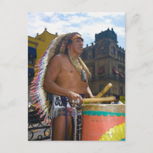 Mature man playing drums with drumstick, Zocalo, Postcard