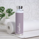 Mauve Personalised Wedding Bridesmaid Colour Water Bottle<br><div class="desc">Gift your wedding bridesmaid or maid of honour with this trendy,  vacuum Insulated water bottle that features her name in white,  stylised script on a mauve colour background designed to match your wedding colour scheme. Personalise bottle by editing and replacing with desired name. Select your water bottle style.</div>