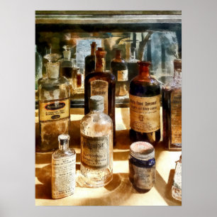 Medicine Bottles in Glass Case Poster