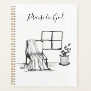 Meditation chair by window with plant and throw planner