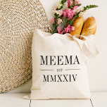 Meema Roman Numeral Year Established Tote Bag<br><div class="desc">A modern minimalist tote bag to celebrate a chic grandma,  this clean minimal tote features "Meema" or your choice of grandma nickname in black serif lettering. Customise with the year she became a grandmother beneath in elegant roman numerals for a chic touch.</div>