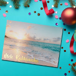 Mele Kalikimaka Beautiful Beach Christmas Gold Foil Holiday Card<br><div class="desc">These pretty seaside Christmas gold foil cards feature gorgeous coastal seascape at sunrise with lovely typography that reads Mele Kalikimaka. A cute Hawaiian way to say Merry Christmas in style. Take me to the beach this holiday.</div>