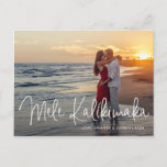 Mele Kalikimaka Modern Beach Photo Christmas Holiday Postcard<br><div class="desc">Send out holiday cheer with this modern Christmas postcard featuring a simple design with the Hawaiian greeting "Mele Kalikimaka" in an elegant thin white script,  along with your names and year over your favourite photo.  The backside has your personal message and your return address for easy mailing.</div>