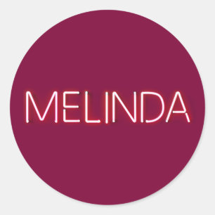 Melinda name in glowing neon lights classic round sticker