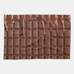 Melted chocolate dripping over a chocolate block tea towel