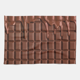 Melted chocolate dripping over a chocolate block tea towel