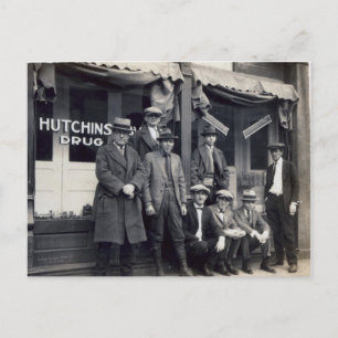 Men In Front of Hutchings-Davis Drug Store Postcard