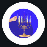 Menorah on Blue Classic Round Sticker<br><div class="desc">Golden menorah being lit for Hanukkah with a Star of David and a gold background.</div>