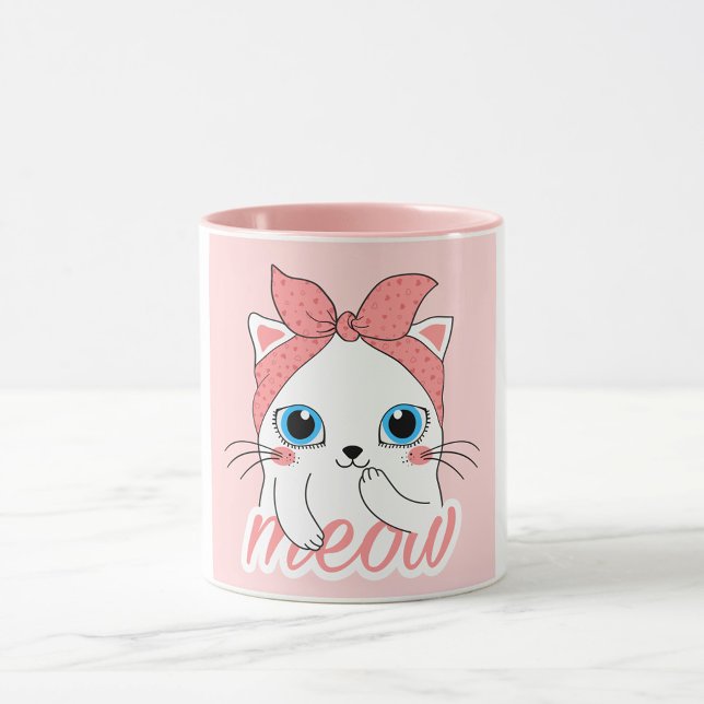 Meow Cat Mug (A white mug with a pink interior and a pink exterior features a cartoon illustration of a white cat.)