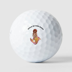 Mermaid water creature with a yellow and pink tail golf balls