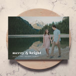 Merry and Bright | Modern Christmas Couple Photo Holiday Card<br><div class="desc">A stylish modern holiday photo flat greeting card with a bold retro typography quote "merry & bright" in white with a dark sage forest green feature colour on the reverse. The greeting, name and message can be easily customised for a personal touch. A trendy, minimalist and contemporary design to stand...</div>