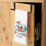 Merry Beachmas Santa Surfing Retro Design Tea Towel<br><div class="desc">Merry Beachmas,  Santa surfin',  colourful retro typography,  Christmas in July design.</div>
