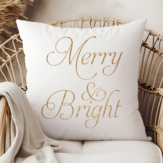 Merry & Bright - Gold and White Christmas Pillow (Merry & Bright - Gold and White Christmas Pillow on a boho rattan armchair.)