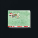 Merry ChrisMUSH Cartoon Mushrooms Post-it Notes<br><div class="desc">Use these cute cartoon mushroom caps (wearing caps) for fun holiday notes. Text (that can be customised) reads: Merry ChrisMUSH! These have a textured watercolor pattern in green on the paper and a candy cane narrow border on the bottom in red and white. Spread the cheer! Happy Holidays!</div>
