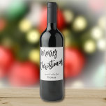 Merry Christmas Black & Platinum, Name on Set of 6 Wine Label<br><div class="desc">Elegant black brush script, Merry Christmas, on a platinum colour background, greeting and family or personal names. Perfect bottle label for gifting a bottle of wine during the holidays... for a party hostess, neighbour, boss, family or to have on hand for an impromptu get-together at home. You will receive six...</div>