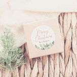 Merry Christmas Calligraphy & Family Name Greenery Classic Round Sticker<br><div class="desc">A chic Christmas sticker, with "Merry Christmas" in elegant red script calligraphy. Underneath, your family name is printed in classic serif typography. At the bottom of the sticker, there is an arrangement of lush winter foliage, bright red berries, holly, and pine. Ideal for sealing envelopes, decorating gift boxes, or embellishing...</div>