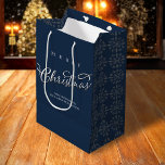 Merry Christmas Calligraphy Navy Blue Snowflake Medium Gift Bag<br><div class="desc">This design features a Merry Christmas cute calligraphy script, an elegant silver snowflake pattern, a navy blue motif pattern style, winter snow elegance whimsical, a stylish trendy calligraphy script font, minimalist minimal white lettering, Christmas holiday wrapping supplies, custom customised gift message greeting, Christmas holiday paper gift packaging, simplistic party favour...</div>