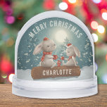 Merry Christmas Cute Winter Rabbits Personalised Snowglobe<br><div class="desc">Merry Christmas Cute Winter Rabbits Personalised Snow Globes features cute rabbits drinking coffee sitting on a log in the snow with Christmas trees and the moon in the background with the text "Merry Christmas" in modern script typography with your custom name on the log. Personalise by editing the text in...</div>
