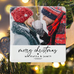 Merry Christmas Family/Couple's Names 2-Photo Ceramic Ornament<br><div class="desc">Spread Christmas cheer with this charming personalised photo ornament featuring a black and white design. The front showcases a photo with the greeting "Merry Christmas" in elegant handwritten script, along with your family or couple's names and the year, all set against a crisp white background. The back displays another photo....</div>