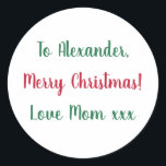 Merry Christmas from Mum Red and Green Classic Round Sticker<br><div class="desc">This is a Christmas gift tag label in festive red and green. It has the message Merry Christmas Love Mum xxx in stylish typography script. To personalise, simply change the name Alexander to your loved one's name in the personalise this text box. Want to make more changes? All of the...</div>