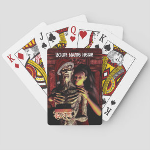 Merry Christmas. Funny skeleton with woman Playing Cards