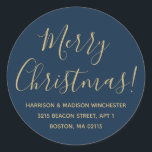 Merry Christmas gold blue script return address Classic Round Sticker<br><div class="desc">Merry Christmas gold and blue modern custom script calligraphy name and address personalised Christmas return address stickers.
Fully customisable faux gold text,  blue background.
Elegant,  simple,  modern design.</div>