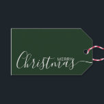 Merry Christmas Green White Minimalist Gift Tags<br><div class="desc">This minimalist and elegant gift tag features white Merry Christmas text on the front side and on the back side personalise it with your name or family name. The background is in green colour.</div>