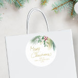 Merry Christmas Greenery Classic Round Sticker<br><div class="desc">This festive sticker is decorated with red,  green,  and gold watercolor foliage and says Merry Christmas in script typography. 
Easily customisable. 
Original Watercolor © Michele Davies.</div>