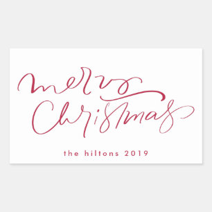 Merry christmas hand lettering in red rectangular sticker