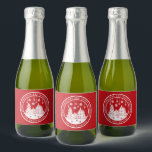 Merry Christmas Happy Holidays Winter Personalised Sparkling Wine Label<br><div class="desc">Merry Christmas Happy Holidays Winter Personalised Name sparkling wine Labels features the text "Merry Christmas and Happy Holidays" in modern white script on a red background and personalised with your name surrounding a home with Christmas trees and snowflakes. Perfect for Christmas party favours and Holiday gifts. Designed by ©Evco Studio...</div>