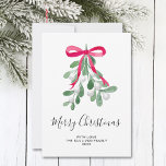 Merry Christmas Mistletoe Holiday Card<br><div class="desc">This holiday card is decorated with watercolor green mistletoe,  a red ribbon,  and stylish script typography that says "Merry Christmas"
Easily customisable.
Original Watercolour © Michele Davies.</div>
