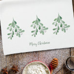 Merry Christmas Mistletoe Tea Towel<br><div class="desc">This Merry Christmas kitchen towel is decorated with watercolor mistletoe foliage and berries.
Easily customisable.
Use the Design Tool to change the text size,  style,  or colour.
As we create our artwork you won't find this exact image from other designers.
Original Watercolor © Michele Davies.</div>