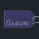 Merry Christmas Navy Blue White Minimalist Gift Tags<br><div class="desc">This minimalist and elegant gift tag features white Merry Christmas text on the front side and on the back side personalise it with your name or family name. The background is in navy blue colour.</div>