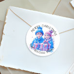 Merry Christmas Personalised Watercolor Classic Round Sticker<br><div class="desc">Pretty watercolor Christmas personalised holiday stickers. Merry Christmas with your Family Name. Two cute vintage kids,  a boy and girl,  brother and sister holding gift boxes in blue and pink winter hats.</div>