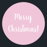 Merry Christmas Pink Typography Classic Round Sticker<br><div class="desc">Trending pink Merry Christmas design. This design has the festive message “Merry Christmas!” In modern white typography text on a light pink background. Perfect for envelope seals or for the finishing touch to your gifts or favour bags this holiday season. If you wish to change the message you can do...</div>