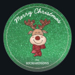 Merry Christmas Reindeer Sticker<br><div class="desc">Add a touch of sparkle and holiday cheer to your gifts, cards, or party favours with this adorable Merry Christmas sticker, featuring a jolly cartoon reindeer with glittery antlers and a red scarf — all set against a festive green glitter-style background (printed effect only). Personalise the bottom with your family...</div>
