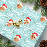 Merry Christmas Santa Photo Cute Face Blue Wrapping Paper<br><div class="desc">Make your gifts stand out this holiday season with custom photo wrapping paper! This fun face-in-a-hole template is personalised with a favourite photo, and features a festive Santa Claus hat, complete with snowflakes, stars, and the greeting "Merry Christmas" in a cheerful font. It's a simple, stylish design, perfect for pictures...</div>