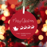 Merry Christmas Santa Sleigh Photo Red Metal Tree Decoration<br><div class="desc">Fun seasonal red and white Christmas tree ornament featuring a silhouette of reindeers flying Santa's sleigh through air and "Merry Christmas" in a stylish modern script and your name or other text below. Add a photo on the back.</div>