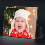 Merry Christmas Script Overlay Chic Baby Photo Plaque<br><div class="desc">Elegant Merry Christmas photo plaque with beautiful cursive script in white. This modern holiday baby photograph gift features gorgeous typography and your custom text over the full bleed picture in white at the top. Perfect to celebrate a smiling baby or happy child.</div>